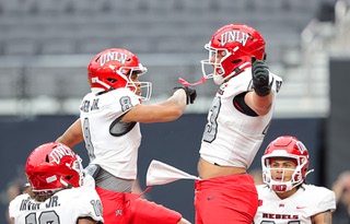 UNLV Rebels wide receiver Timothy Conerly (8) celebrates with tight end Jae Beasley II (43) afterBeasley’s touchdown reception during the UNLV Football Spring Showcase at Allegiant Stadium Saturday, April 6, 2024.