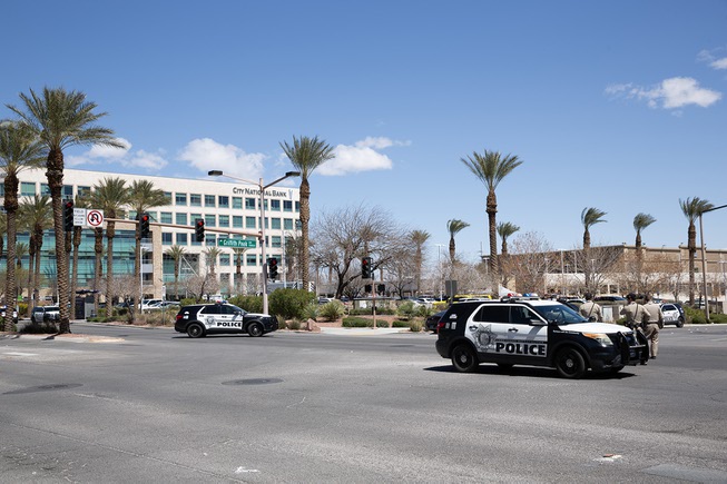 Police and emergency response crews work the scene of a shooting that left 3 dead at a law office near Red Rock Resort & Casino, Monday April 8, 2024.