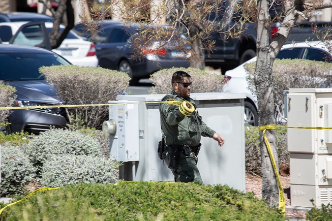 Police and emergency response crews work the scene of a shooting that left 3 dead at a law office near Red Rock Resort & Casino, Monday April 8, 2024.