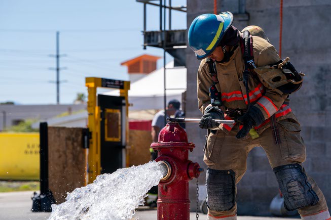 A firefighter academy student in training, demonstrates the flushing of a hydrants at the Las Vegas Fire Department Training Center on 633 N Mojave Rd in Las Vegas, Nevada on Tuesday, April 9, 2024.