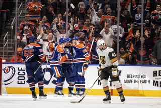 Vegas Golden Knights' Paul Cotter (43) skates past as the Edmonton Oilers celebrate a goal during the first period in Edmonton, Alberta, on Wednesday April 10, 2024.


