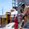 A firefighter academy student in training, demonstrates the flushing of a hydrants at the Las Vegas Fire Department Training Center on 633 N Mojave Rd in Las Vegas, Nevada on Tuesday, April 9, 2024.