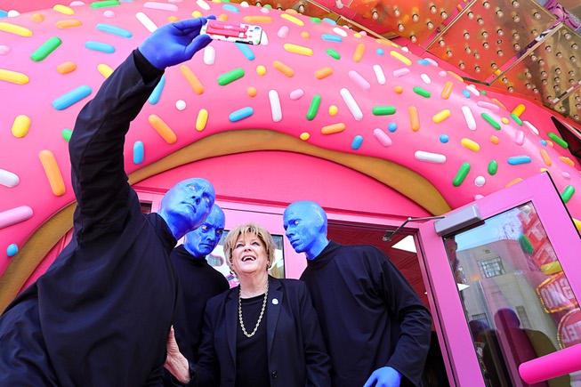 Las Vegas Mayor Carolyn Goodman and members of Blue Man Group pose during a promotional kick-off for Blue Man Group-inspired doughnuts at The Plaza in downtown Las Vegas Friday, April 12, 2024. The limited-edition doughnuts are called Blue Poo and Throwdown.