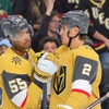 Vegas Golden Knights right wing Keegan Kolesar (55) is congratulated by Zach Whitecloud (2) after scoring against the Minnesota Wild during the third period of an NHL hockey game at T-Mobile Arena Friday, April 12, 2024.
