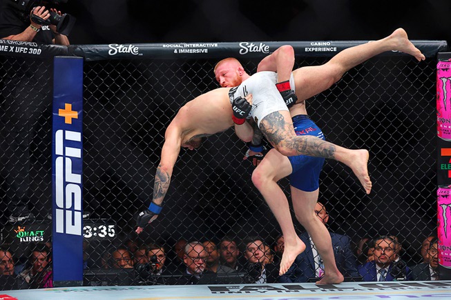 Bo Nickal picks up Cody Brundage in a middleweight bout during UFC 300 at T-Mobile Arena Saturday, April 13, 2024, in Las Vegas. Nickal won by submission in the second round.