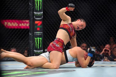 UFC Women’s strawweight champion Zhang Weili punches Yan Xiaonan in a women’s title fight during UFC 300 at T-Mobile Arena Saturday, April 13, 2024, in Las Vegas. Zhang retained her title by unanimous decision.