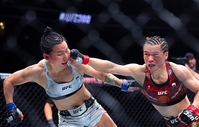 UFC Women’s strawweight champion Zhang Weili, right, punches Yan Xiaonan in a women’s title fight during UFC 300 at T-Mobile Arena Saturday, April 13, 2024, in Las Vegas. Zhang retained her title by unanimous decision.