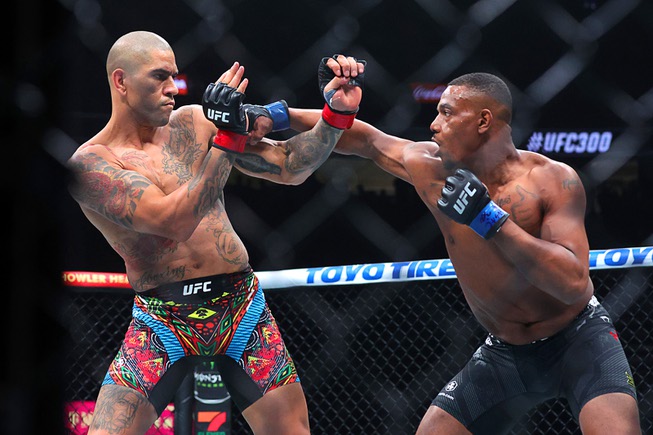 UFC light heavyweight champion Alex Pereira avoids a punch from Jamahal Hill during UFC 300 at T-Mobile Arena Saturday, April 13, 2024, in Las Vegas.