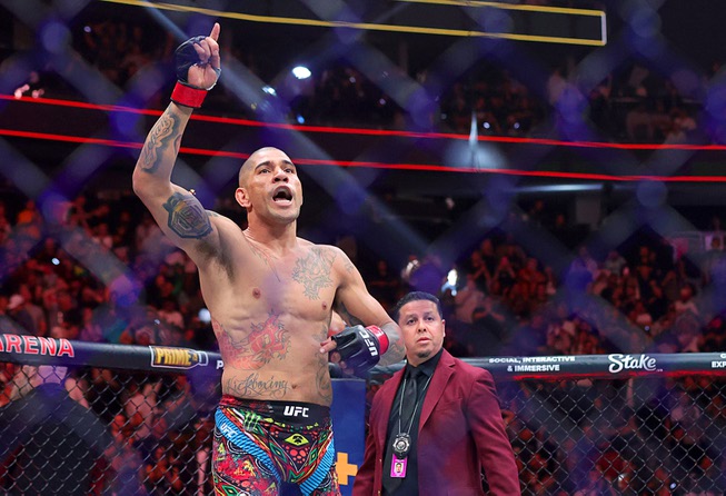 UFC light heavyweight champion Alex Pereira celebrates after defeating Jamahal Hill in a title defense during UFC 300 at T-Mobile Arena Saturday, April 13, 2024, in Las Vegas. Pereira retained his title with a first-round TKO.