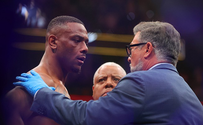 Jamahal Hill is checked out by a physician after losing a title fight against UFC light heavyweight champion Alex Pereira during UFC 300 at T-Mobile Arena Saturday, April 13, 2024, in Las Vegas. Pereira retained his title with a first-round TKO.