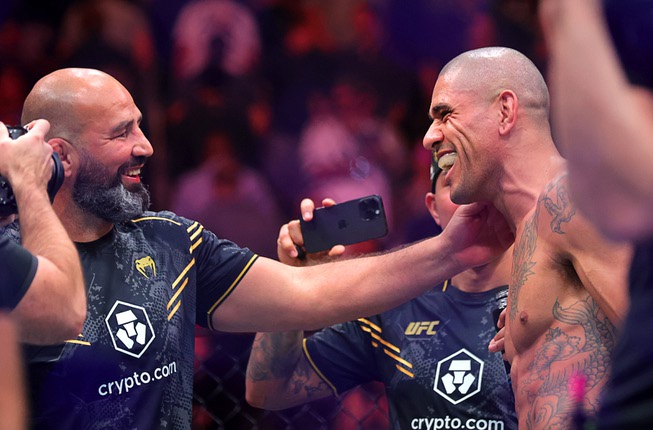 UFC light heavyweight champion Alex Pereira, right, celebrates with members of his team after defeating Jamahal Hill in a title defense during UFC 300 at T-Mobile Arena Saturday, April 13, 2024, in Las Vegas. Pereira retained his title with a first-round TKO.