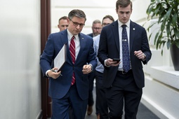 House Speaker Mike Johnson, R-La., left, arrives for a closed-door meeting with fellow Republicans at the Capitol in Washington, Monday, April 15, 2024. 

