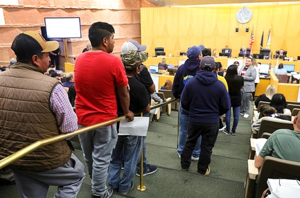 People, many of them street vendors, line up to comment on a street vendor ordinance during a Clark County meeting on a street vendor ordinance at the Clark County Government Center Tuesday, April 16, 2024.
