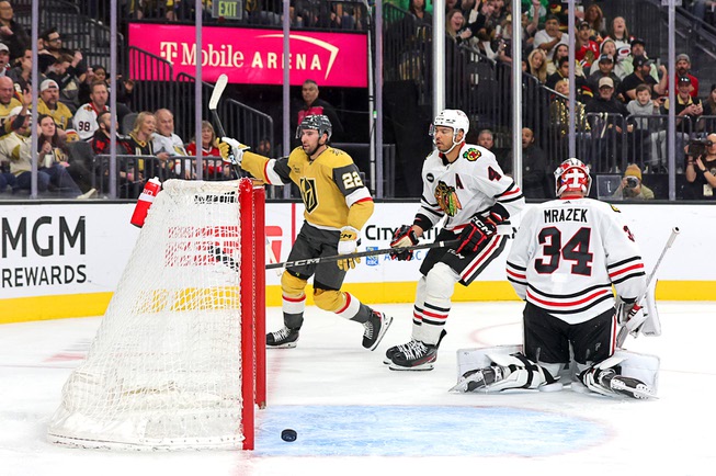 Vegas Golden Knights right wing Michael Amadio (22) celebrates after scoring against Chicago Blackhawks goaltender Petr Mrazek (34) during the third period of an NHL hockey game at T-Mobile Arena Tuesday, April 16, 2024. Chicago Blackhawks defenseman Seth Jones (4) is at center.