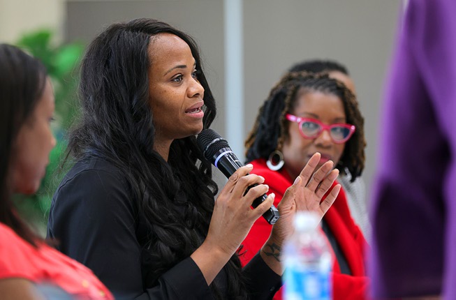 Shenakwa Hawkins, a nurse practitioner,  speaks during a Black Maternal Health Panel Discussion at the Doolittle Senior Center Wednesday, April 17, 2024. The event was part of Black Maternal Health Week and promoted by the Biden-Harris campaign.
