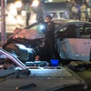 Photo: A Metro Police crime scene analyst takes photos at