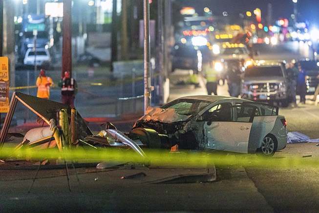 A view of a fatal accident scene on southbound Boulder Highway Wednesday, April 17, 2024. An adult and child were killed and three others were injured, police said.