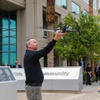 Gregory Stevens, Metro Detective, reaches out to grab the drone after a demonstration flight at the LVMPD Headquarters in Las Vegas, Nevada on Thursday, April 18, 2024.