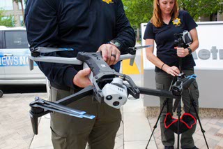 Steven Oscar, Unmanned Aerial Systems Program coordinator, gives a closer look at the drone during the demonstration flight at the LVMPD Headquarters in Las Vegas, Nevada on Thursday, April 18, 2024.