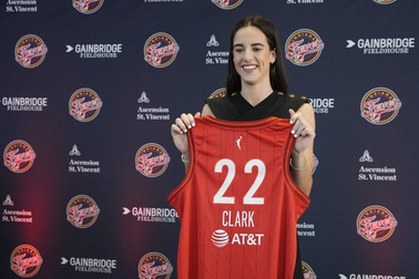 Indiana Fever's Caitlin Clark holds her jersey following a WNBA basketball news conference, Wednesday, April 17, 2024, in Indianapolis. 