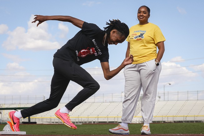 Tony Williams III, a Mojave high school senior who recently broke his team’s 400 meter track record with a time of 47.77 seconds, poses for a photo Thursday, April 25, 2024 with his mother, Monique Lewis, who also holds a record at the school in the 100 meter and 200 meter relay.
