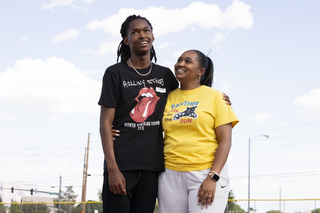 Tony Williams III, a Mojave high school senior who recently broke his team’s 400 meter track record with a time of 47.77 seconds, poses for a photo Thursday, April 25, 2024 with his mother, Monique Lewis, who also holds a record at the school in the 100 meter and 200 meter relay.
