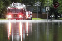 A Houston firetruck makes it way through flood water in North Woodland Hills after severe flooding, Thursday, May 2, 2024, in the Houston neighborhood of Kingwood, Texas.


