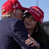 Republican presidential candidate and former President Donald Trump, left, embraces South Dakota Gov. Kristi Noem at a campaign rally Saturday, March 16, 2024, in Vandalia, Ohio. 