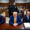 Former President Donald Trump, center, at his criminal trial in Manhattan on Thursday, May 2, 2024. Trump is accused of falsifying records to cover up a sex scandal that threatened to derail his 2016 presidential campaign and faces 34 felony counts. 
