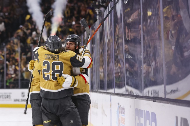 Vegas Golden Knights defenseman Noah Hanifin (15) celebrates with his team after scoring against Dallas Stars goaltender Jake Oettinger (29) during the third period of Game 6 of an NHL hockey Stanley Cup first-round playoff series against the Dallas Stars at T-Mobile Arena Friday, May 3, 2024.