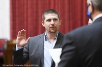 In this image provided by the West Virginia Legislative Photography, Derrick Evans is shown during his swearing-in ceremony to the West Virginia House of Delegates on Dec. 1, 2020, in Charleston, W.Va. Evans resigned after he joined the mob that stormed the U.S. Capitol on Jan. 6, 2021. Evans served three months in federal prison for his participation and is running for a U.S. House seat on Tuesday, May 14, 2024, in the West Virginia Republican primary against 1st District incumbent Rep. Carol Miller. 


