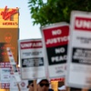Culinary Workers Union 226 and Bartenders Union Local 165 picket outside of Virgin Hotels Las Vegas.
