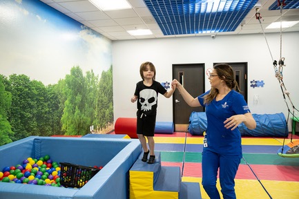 Morgan Hicks, behavioral technician, interacts with 6-year-old Christopher Wilson during a treatment session at Touro University’s Pierce Autism Center Thursday May 9, 2024.