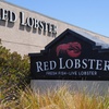 Signs for a Red Lobster restaurant are shown in San Bruno, Calif., Tuesday, May 14, 2024.