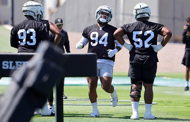 Las Vegas Raiders defensive tackle Christian Wilkins (94) runs a drill during organized team activities at the Las Vegas Raiders Headquarters/Intermountain Health Performance Center in Henderson Tuesday, May 21, 2024.