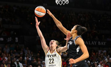 Las Vegas Aces center Kiah Stokes (41) defends against Indiana Fever guard Caitlin Clark (22) during the first half of an WNBA basketball game at Michelob Ultra Arena in Mandalay Bay Saturday, May 25, 2024.