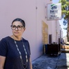 Angela Phillips, executive director of Habitat for Humanity Las Vegas, stands behind the Habitat for Humanity Las Vegas ReStore warehouse on West Sahara Avenue Friday, May 24, 2024. An April 21 arson fire damaged the warehouse roof and a roll-up door.