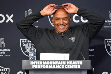 Las Vegas Raiders assistant head coach Marvin Lewis adjusts his cap while talking with reporters during organized team activities (OTA) at the Raiders Headquarters/Intermountain Health Performance Center in Henderson Wednesday, May 29, 2024.