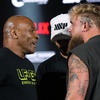 Mike Tyson, left, and Jake Paul, right, face off during a news conference promoting their upcoming boxing bout, Thursday, May 16, 2024, in Arlington, Texas. 