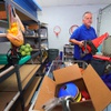 Tom Hughes, athletic director at St. Anne Catholic School, sorts though an equipment storage area at the school Wednesday, June 5, 2024. Hughes has worked at the school for 22 years, he said. The kindergarten through 8th grade school, which opened in 1954, closed this May.