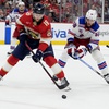Florida Panthers center Steven Lorentz (18) skates with the puck as New York Rangers left wing Will Cuylle (50) defends during the second period of Game 6 in the Eastern Conference finals of the NHL hockey Stanley Cup playoffs Saturday, June 1, 2024, in Sunrise, Fla.