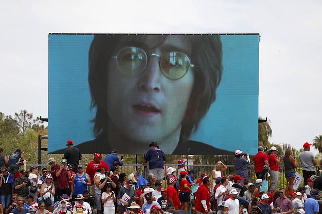 A music video of John Lennon’s “Imagine” is played during a Donald Trump campaign rally at Sunset Park Sunday, June 9, 2024.