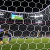 Scotland's goalkeeper Angus Gunn, front reacts after Germany's Niclas Fuellkrug scored his side's fourth goal during a Group A match between Germany and Scotland at the Euro 2024 soccer tournament in Munich, Germany, Friday, June 14, 2024.