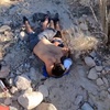 This still image from video provided by the Riverside County Sheriff's Office shows two hikers lying on the ground as Riverside County Sheriff's Aviation Unit's Rescue 9 was dispatched to the Ladder Canyon Trail in Mecca, Calif., to assist the hikers, who were requesting medical aid, June 9, 2024. The couple, hiking in the desert south of Joshua Tree National Park in Southern California, was rescued after running out of water. 