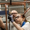17-year-old Bella Robertson solders piping as her instructor Neal Fouts watches during the Heavy Metal Summer Experience at MMC Contractors Las Vegas Tuesday July 9, 2024. The 5-day camp exposes students to trades such as sheet metal working, piping and plumbing by working craft professionals.