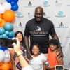 Shaquille O’Neal takes photos with some of the kids at an event held at Mario C. & Joanne Monaco Middle School to unveil details of a future youth facility for the Northeast side in Las Vegas, Nevada, on Wednesday, July 10, 2024.