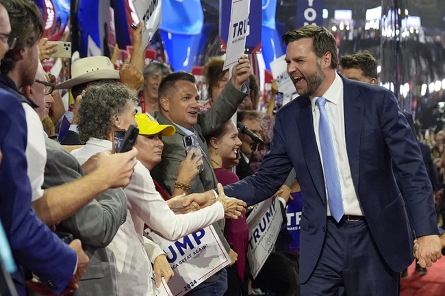 Republican vice presidential candidate Sen. JD Vance, R-Ohio, greets delegates as he arrives on the floor during the first day of the 2024 Republican National Convention at the Fiserv Forum, Monday, July 15, 2024, in Milwaukee.


