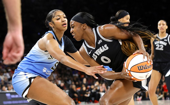 Las Vegas Aces guard Jackie Young (0) drives against Chicago Sky forward Angel Reese (5) during the first half of an WNBA basketball game at the Michelob Ultra Arena in Mandalay Bay Tuesday, July 16, 2024.