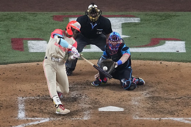 American League's Jarren Duran, of the Boston Red Sox, hits a home run during the fifth inning of the MLB All-Star baseball game, Tuesday, July 16, 2024, in Arlington, Texas. Anthony Santander, of the Baltimore Orioles, also scored. 


