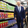 President Joe Biden walks with Rep. Steve Horsford, D-Nev., as he visits Mario's Westside Market in Las Vegas, Tuesday, July 16, 2024. 